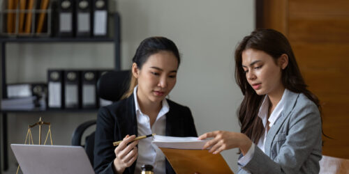 Businesswoman and female lawyer consult having team meeting with client, Law and Legal