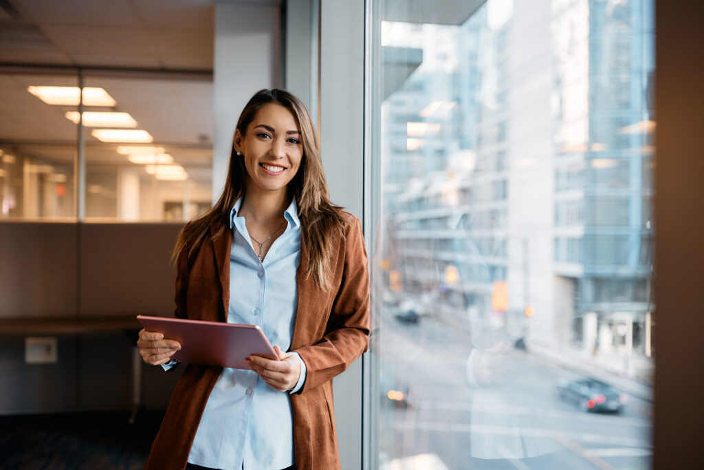 Business woman against window